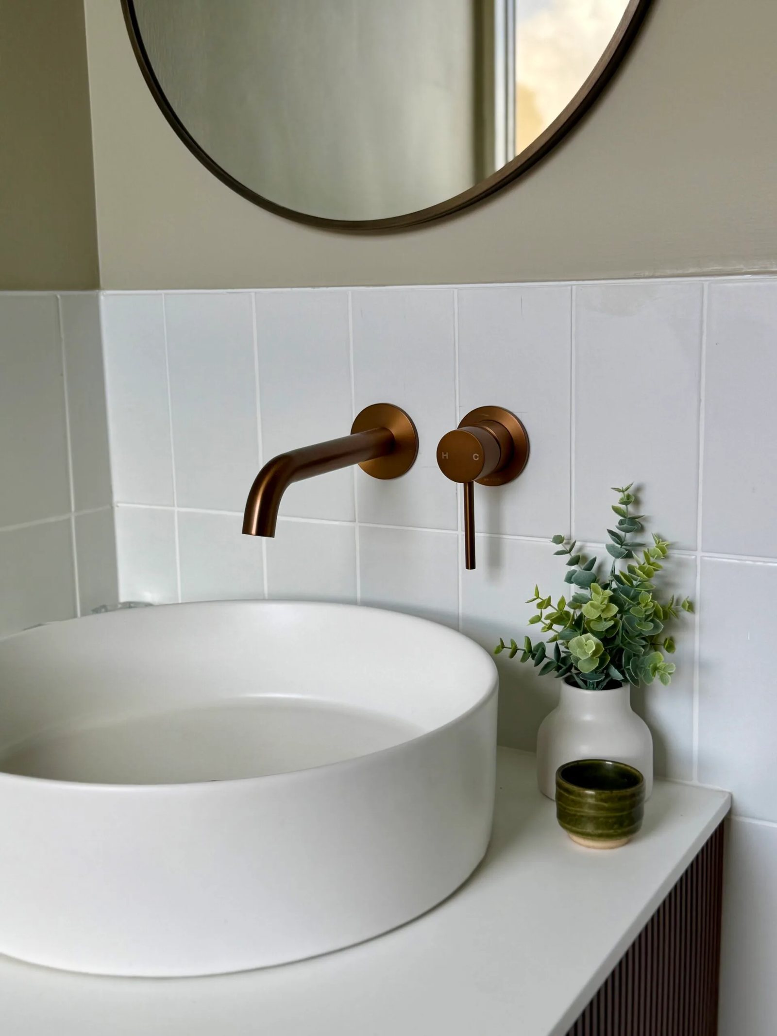 A basin with a brass tap in one of the rooms upstairs