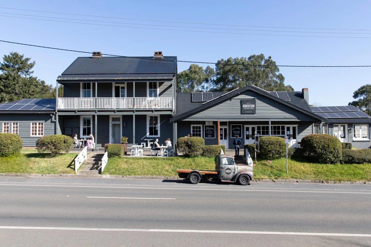 Robertson Public House from the Illawarra Highway, grey weatherboard and verandah